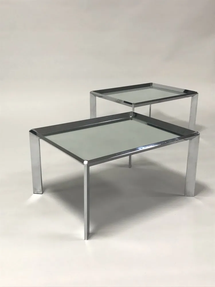 Pair of vintage mid century modern chrome tables with mirror tops in the style of Milo Baughman