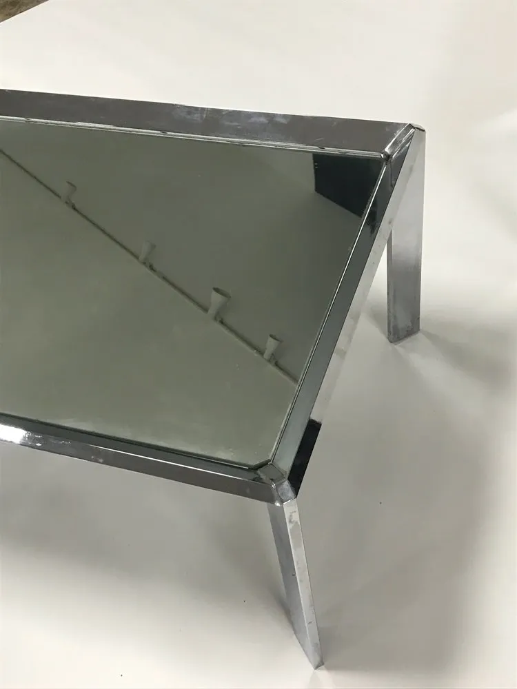 Pair of vintage mid century modern chrome tables with mirror tops in the style of Milo Baughman